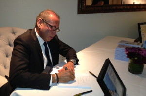 Dr. Andre Berger, signing his new book. Photo by Karen Salkin.