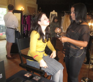 Sandy getting her make-up done. That's our fabulous "guide" Tucker off to the left. Photo by Karen Salkin.