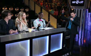 The Sing-Off judging panel and host Nick Lachey.