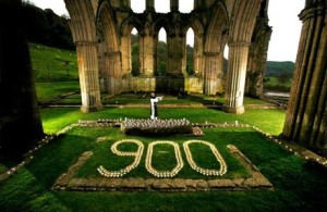 This "900" represents the 900th anniversary of the founding of the St. Aelred of Riecaulx Abbey in Yorkshire, England. Check-out that "sleep-walking" priest in the middle.