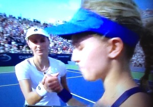 Eugenie Bouchard, on the right, giving one of the coldest handshakes I've ever witnessed to the girl who beat her, Ekaterina Makarova. She wouldn't even look at the victor!  Photo by Karen Salkin.