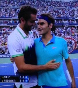 Roger Federer, on the right, telling Marin Cilic, who just beat him in the semi-final, "I'm happy for you," and meaning it!  What a man!   Photo by Karen Salkin.