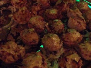 The over-flowing crab cakes, shot in too-low lights. Photo by Karen Salkin.