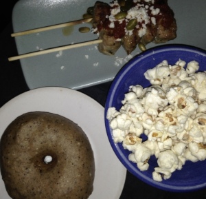 (Clockwise from bottom left): brioche donut, meatball skewers, popcorn. Photo by Karen Salkin. 
