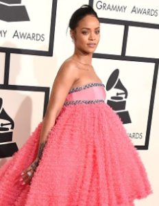 Just because I had no other place to put it, here's Rihanna's crazy dress.  Even worse than her muffin-topping boobs is her knarly messed-up hair.  How pissed is she that her hair looks like that in every picture?!  