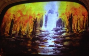 The painting which contains the meaning of the story, on the curtain at the Pasadena Playhouse.  Photo by Karen Salkin.