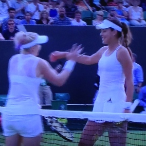 It's totally blurry, but look at how nice Ana Ivanovic (on the right) is in defeat.  Photo by Karen Salkin.