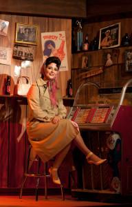 Cori Cable Kidder as Patsy Cline, sitting in yet another area of the fabulous set. Photo by Gina Long.