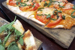 A bit of both Flatbreads we loved.  The pear and brie is just peeking out a bit.  Photo by Flo Selfman.