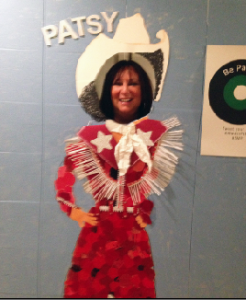 There's a fun, appropriate exhibit in the lobby, which includes this "Patsy" cut-out. Doesn't INAM's Karen Salkin look happy to stick her head out of it?  Photo by Alice Farinas.