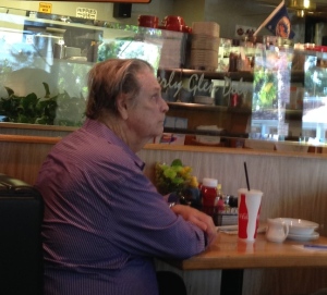 Brian Wilson, watching the Mets game on the TV at the deli.  A man after my own heart! Photo by INAM staff.