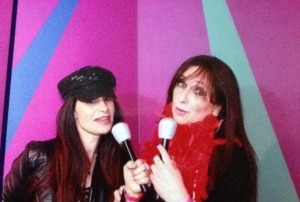 Alice Farinas and Karen Salkin in the photo booth.  (The hat and red boa are props, too.)