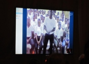 The video chat with the children in Ghana, on the big screen in the banquet room.  Photo by Alice Farinas.