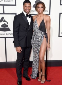 Doesn't Russell Wilson look a tad afraid of his girlfriend, Ciara?  And doesn't she look miserable, as if the dress isn't working on him?  And try to get a close-up gander of her awful toes! 