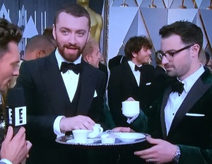 Good-natured Sam Smith and Jimmy Napes having a cuppa tea foisted upon them by Ryan Seacrest.  On the red carpet!!! Photo by Karen Salkin.