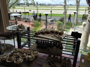 Just part of the dessert bar inside, overlooking the patio.  You can watch the planes from all areas of the eatery.  Photo by Karen Salkin.