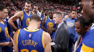 The Golden State warriors, in a game huddle with Coach of the Year, Steve Kerr. 