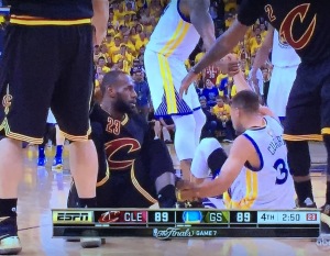 My favorite image of the entire series, which I'm still getting choked-up over.  (I'm honestly crying as I write this the next day!) LeBron knocked Steph over by accident, and as their respective teamates came to help them up, the two superstars took each other's hands to help each other.  Right in the heat of the battle that was Game 7 of the NBA Finals!  Now, that's the epitome of sportmanship! Photo by Karen Salkin.