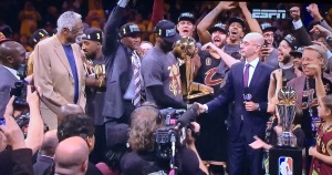 LeBron James receiving his Finals MVP trophy from NBA Commisioner Adam Silver, with NBA legend Bill Russell looking on, on the left. Photo by Karen Salkin.