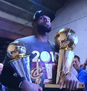 LeBron James, carrying both the team and his individual trophys to the locker room. Photo by Karen Salkin.