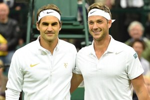 Marcus Willis, alongside his idol, Roger Federer.  There has never been anyone happier to play the best player in the world, on Centre Court, to boot!  He's even wearing clothing and headband from Roger's clothing line!
