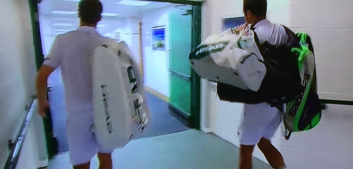 My favorite image of the tournament.  (That's why it's at the top of this page, as well.) Jo-Wilfried Tsonga, (on the right,) carrying the heavy bag of his injured opponent, Richard Gasquet, (on the left.)  I'm getting choked-up just looking at the picture.  Photo by Karen Salkin.