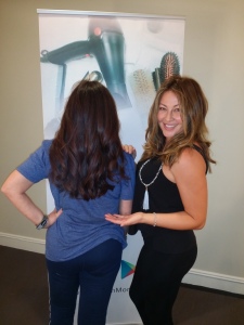 Michelle Cochran from SalonMom (on the right) showing us Karen Salkin's newly-styled tresses (on the left.)  Photo by Alice Farinas. 