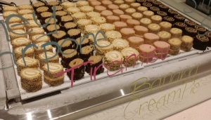 The mini desserts.  (The pastel writing is on the front of the counter, to identify the flavors for you. Photo by Alice Farinas, as is the big one of the menu (and the bread!,) at the top of the page.