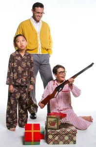 (L-R) Kevin Ying, Jackson Kendall, (as the grown-up Ralphie,) and Griffin Sanford.  (You know that I'm totally against firearms in life, but this one is comedically central to the story.)  Photo by John Dlugolecki.