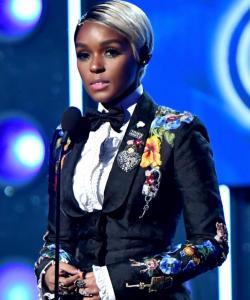 Janelle Monae, in NOT just black and white!  (Except for her hair, of course.)  