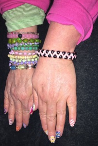Karen Salkin's very colorful clothing and jewelry and Easter e-word nails that...she painted herself!!! Photo by Mr. X.