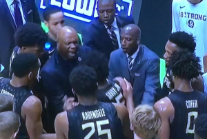 Evil FSU Coach Leonard Hamilton in the middle, screaming at his player whose jersey he's still grabbing!  And the whole scene was so much worse than just this screen grab shows. Photo by Karen Salkin.