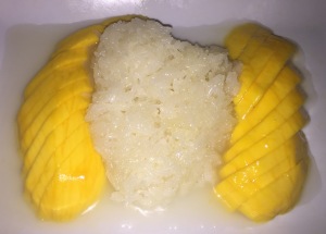 Mango Sticky Rice. (I love that the rice is sort-of in the shape of a heart.  Or a matzoh ball!!!)  Photo by Karen Salkin.
