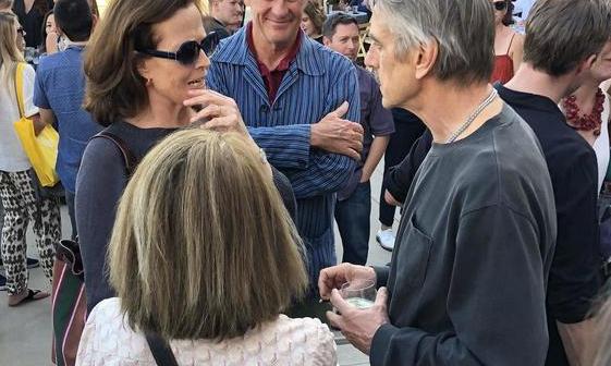 Sigourney Weaver and Jeremy Irons deep in conversation, with an interloper on each side of them!  Photo by Mr. X.
