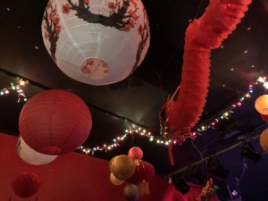 Part of the colorful overhead decorations in the music room of Genghis Cohen.  Photo by Karen Salkin.