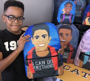 Carter Kelley with the backpack designed with his image!  Photo by Karen Salkin.