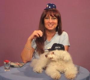 Karen Salkin on Karen's Restaurant Revue, with her co-star, Clarence, The Singing Dog. This pic doesn't look like it has much to do with food, but the little baseball helmets they're rocking had ice cream in them originally, and her shirt says "White Castle."  Photo by Mr. X.
