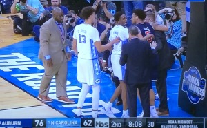 The UNC players going over to show support for their injured opponent, Auburn's Chuma Okeke, after his horrific knee injury. Photo by Karen Salkin.