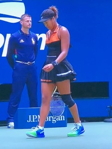 Naomi Osaka's black and orange outift, which was not great colors to begin with, but it totally clashed with those colorful shoes!  Photo by Karen Salkin.