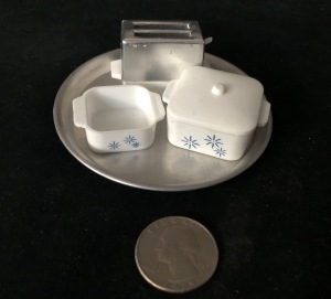 Part of the teensy-tiny houseware set a nice man bought me when I was a teen-ager working at The Corner Shoppe.  I put that quarter in the pic just to show you how small the set is.  Photo by Karen Salkin.