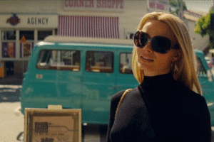 Margot Robbie in Once Upon A Time In Hollywood, with The Corner Shoppe in the background, looking like it did in the early days. 