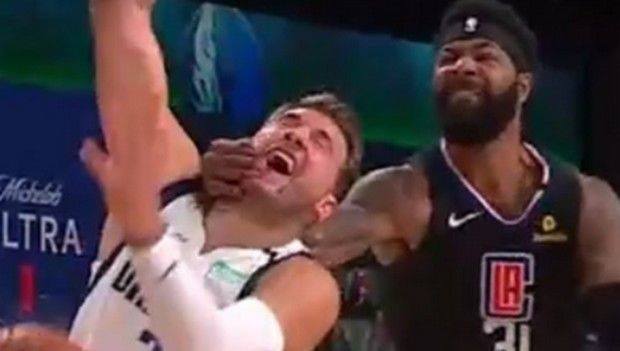 Scumbag Marcus Morris, on the right, grabbing Luka Doncic, on the left. You can see on Morris' face how hard he was trying to harm Luka!