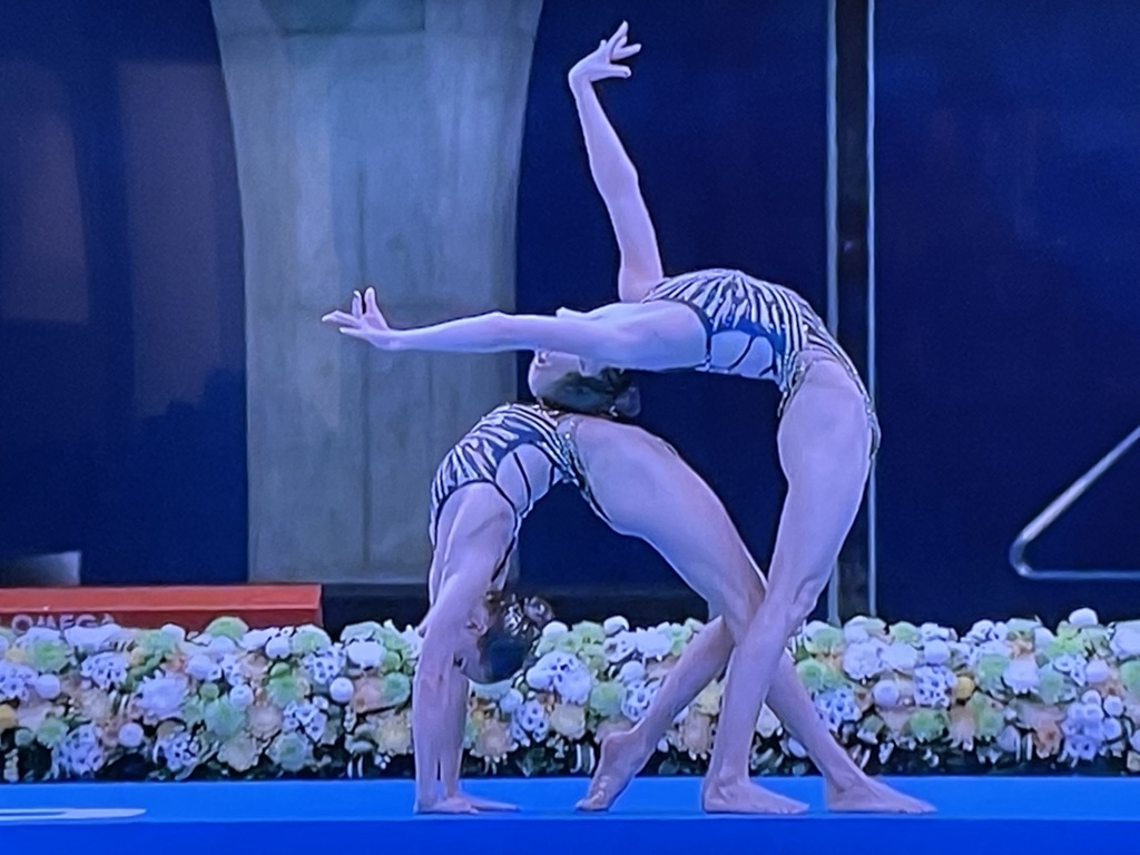  An Artistic Swimmin duo.  And this is just the pre-routine "deck work!"  Wow. Photo by Karen Salkin, off the TV.