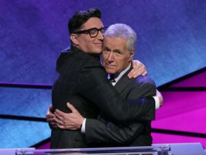 Buzzy Cohen embracing Alex Trebek back in the day, when the former was a champion on Jeopardy.