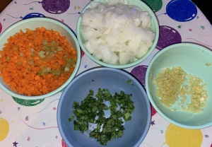 The chopped veggies.  (The celery and carrots are together in one bowl, as they will be for eternity!) Photo by Karen Salkin.