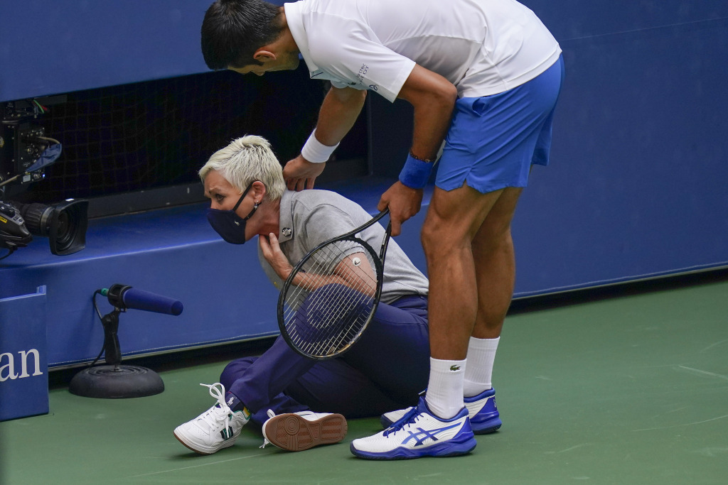 Djocovic with the lineswoman he hit in the throat, (by accident,) at the 2020 US Open.