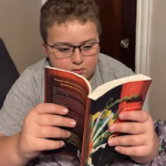 My almost grown-up pal Marcus Jocelyn, engrossed in one of our favorite young adult books! Photo by Amanda Hazel.