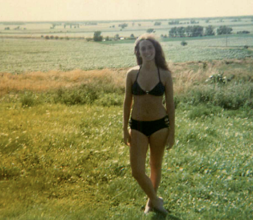 My teen-age self in a cornfield in Nebraska, on the way out to Cali. Photo by Mark something.