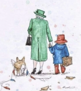 The Queen, Paddington Bear, and one of her beloved corgis. Enough said.