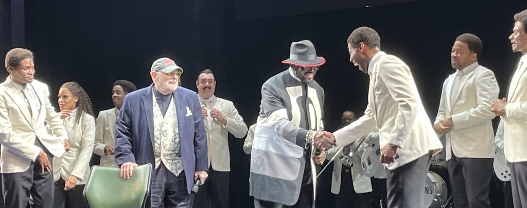 Shelley Berger (in blue) and Otis Williams (in gray) greeting the cast during the opening night curtain call.  Photo by Karen Salkin.